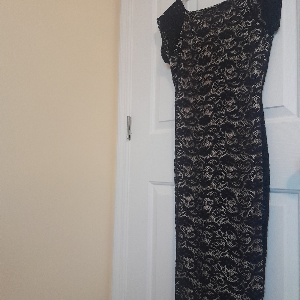 Black lace style fitted dress size medium. Beautiful!